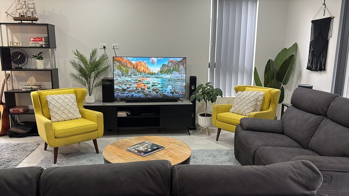 Living room with yellow armchairs in a Merrylands ASDA home